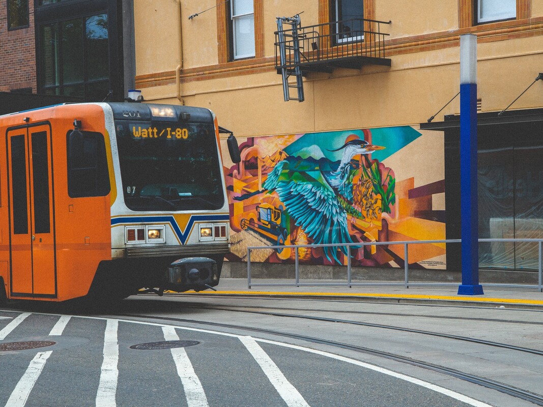 Sacramento public bus in front of colorful downtown Sac mural